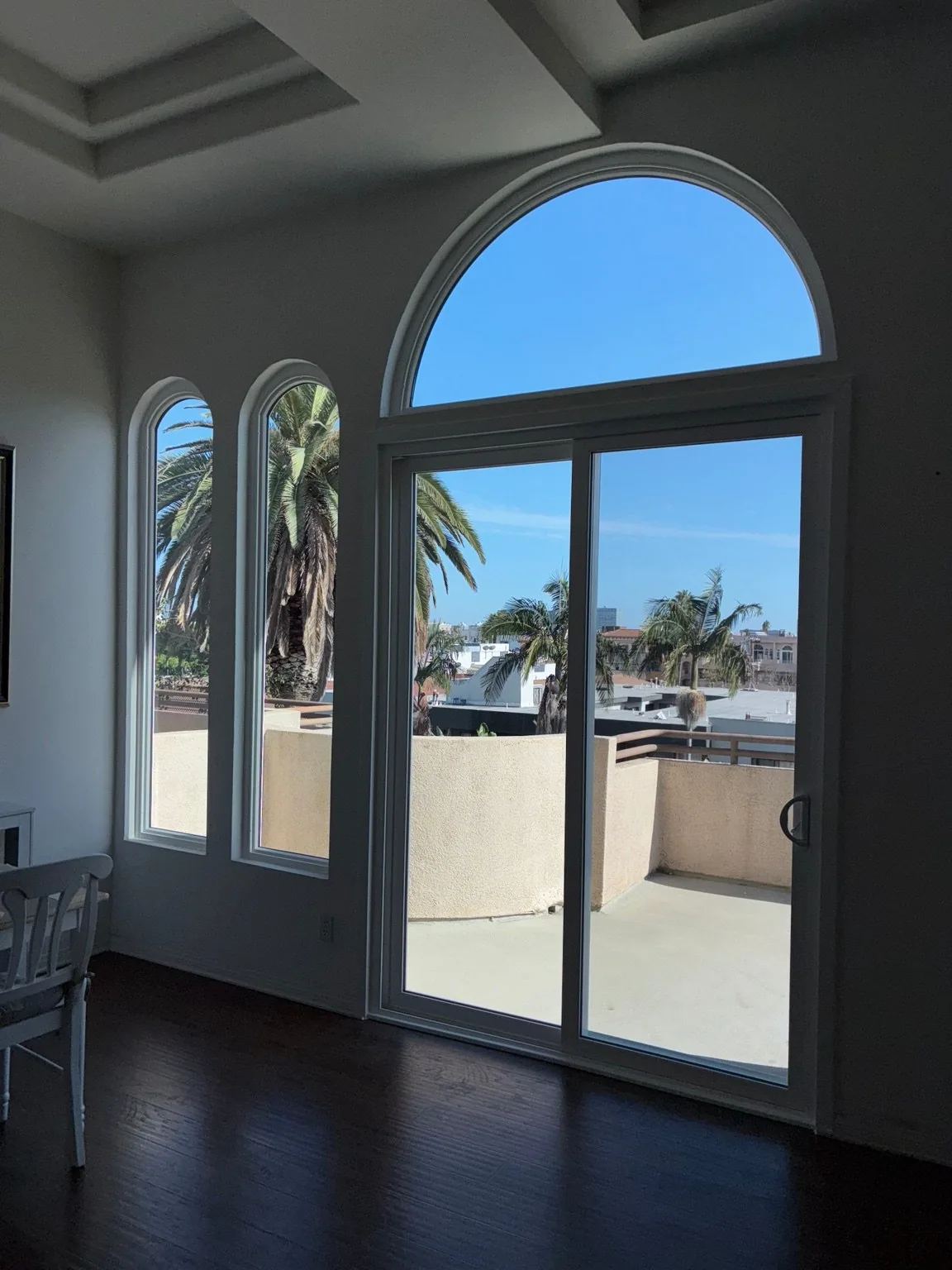 Interior view of completed arched window and patio door installation