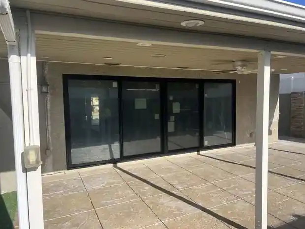 Large black multi-panel sliding door